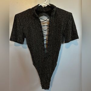Glittery bodysuit. Perfect for a night out or a fun party.
